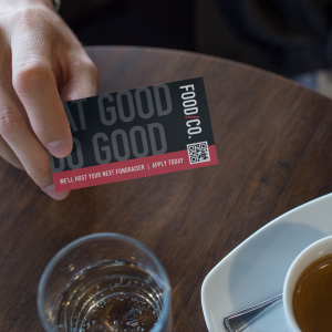 man-showing-a-business-card-template-while-at-the-cafe-a15005
