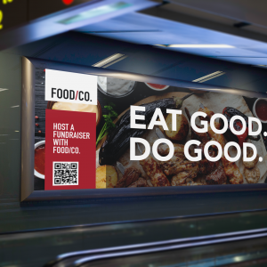 A fundraising billboard for "Food/Co." reading "Eat Good. Do Good."