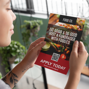 mockup-of-a-woman-reading-an-a5-flyer-27426